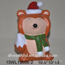 Ceramic animal figurines of fox for holiday decoration